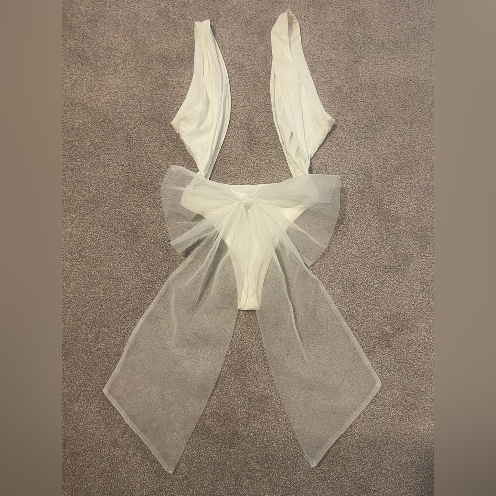 White bathing suit with detacheable bow